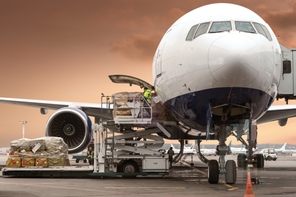 “Cargo being loaded onto an airplane, representing Professional Aviation Services’ expertise in air freight, dangerous goods handling, and secure aviation operations.”
